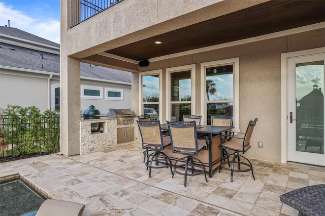 729 Pegasus Ln, League City, TX 77573 - view of patio featuring grilling area, fence, an outdoor kitchen, and outdoor dining area