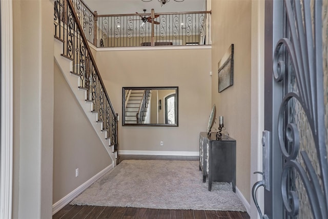 entryway with dark hardwood / wood-style flooring