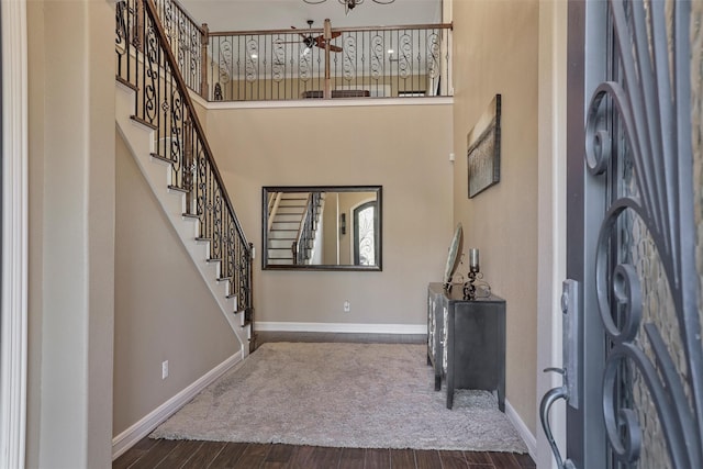 729 Pegasus Ln, League City, TX 77573 - foyer entrance featuring stairway, wood finished floors, baseboards, and a notable chandelier