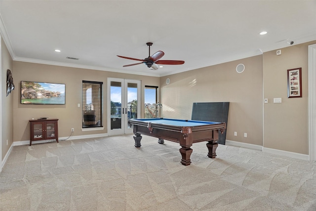 playroom featuring light colored carpet, ornamental molding, and french doors