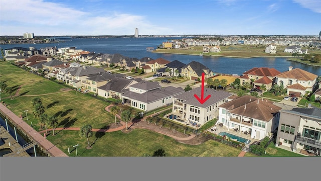 birds eye view of property featuring a water view