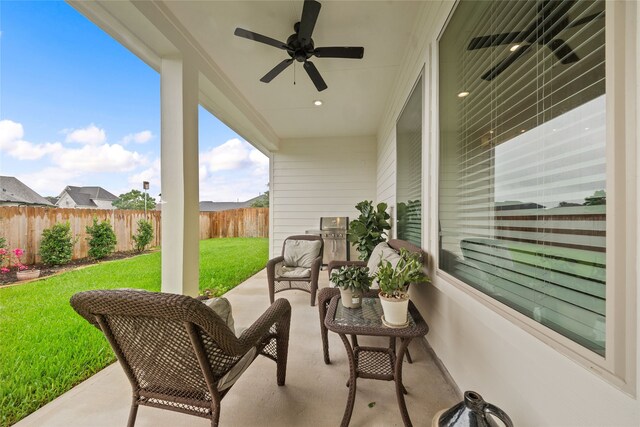 view of patio featuring ceiling fan