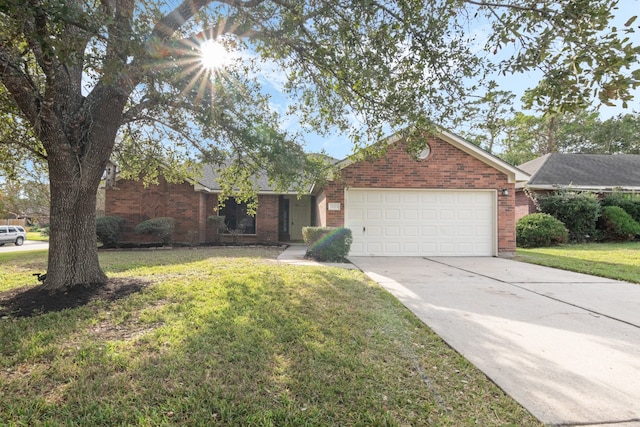 ranch-style home with a garage and a front lawn