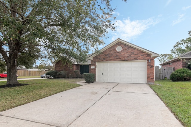 view of front of property featuring a garage and a front lawn