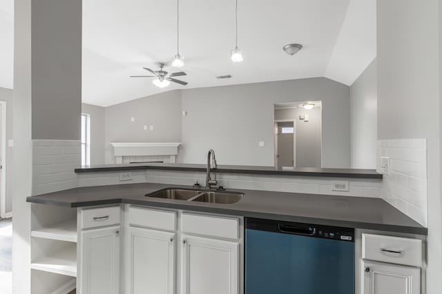 kitchen with lofted ceiling, sink, stainless steel dishwasher, ceiling fan, and white cabinetry