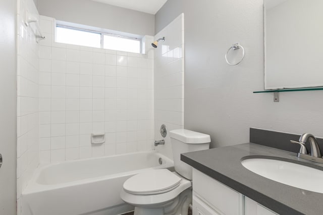 full bathroom with vanity, toilet, and tiled shower / bath