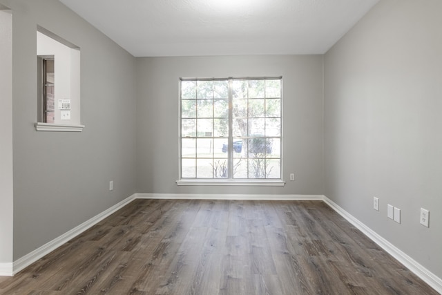 empty room featuring dark hardwood / wood-style flooring