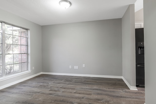 empty room with hardwood / wood-style floors