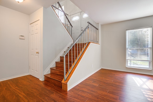 stairs with wood-type flooring