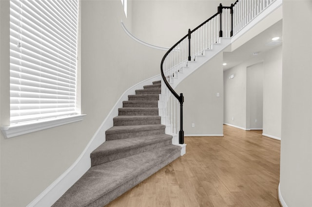 stairs with wood-type flooring