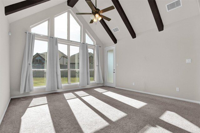 unfurnished living room featuring beam ceiling, ceiling fan, carpet flooring, and high vaulted ceiling