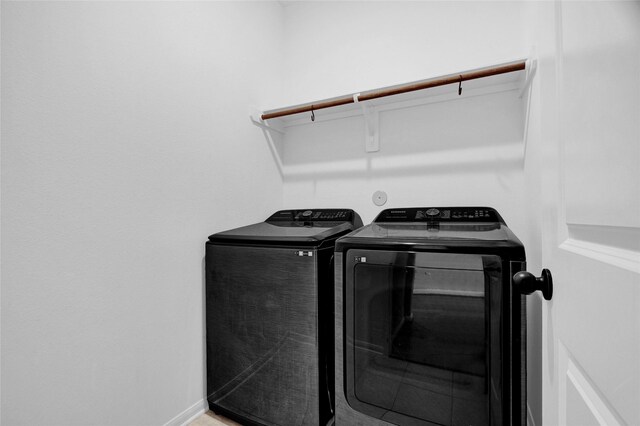 washroom featuring separate washer and dryer