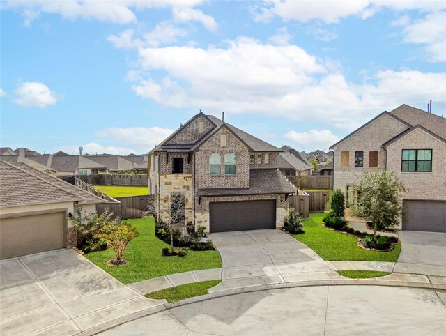 view of front facade featuring a front yard and a garage