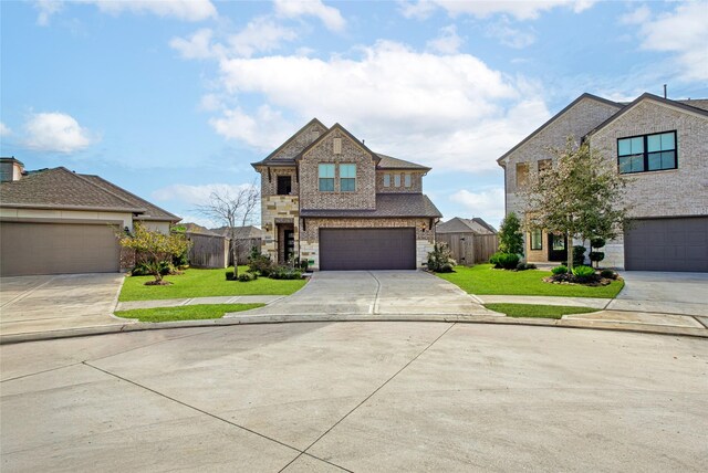 view of front of property with a front lawn and a garage