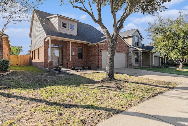 view of front of house with a garage and a front lawn