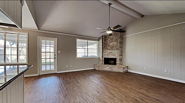 unfurnished living room featuring vaulted ceiling with beams, ceiling fan, a fireplace, a textured ceiling, and wood-type flooring