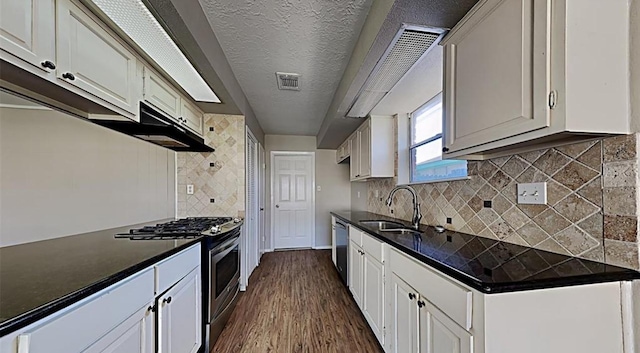 kitchen featuring stainless steel appliances, white cabinetry, and sink