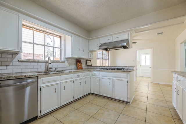 kitchen featuring backsplash, white cabinetry, sink, and stainless steel appliances