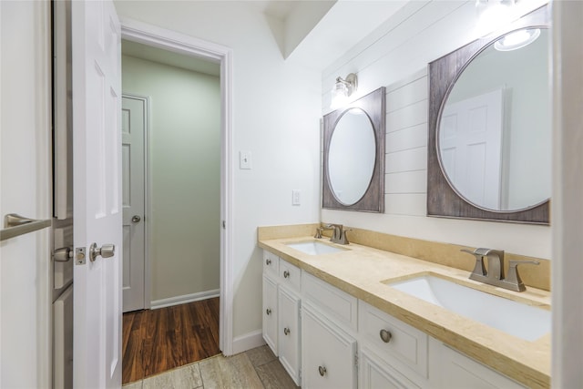 bathroom featuring vanity and wood-type flooring