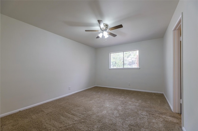 unfurnished room with carpet flooring and ceiling fan