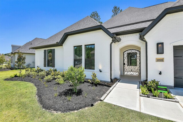 12926 Whitewater Way, Conroe, TX 77302 - view of front of home with roof with shingles and a front yard