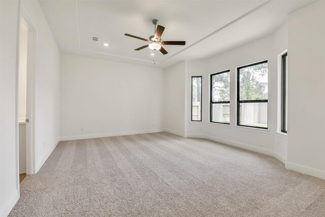 12926 Whitewater Way, Conroe, TX 77302 - empty room with light carpet, a ceiling fan, and recessed lighting