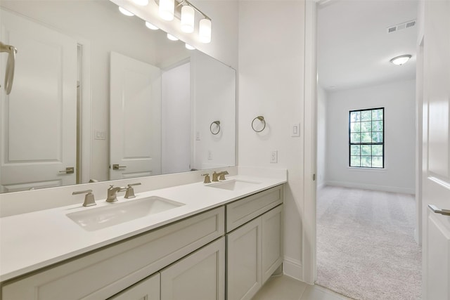12926 Whitewater Way, Conroe, TX 77302 - bathroom featuring double vanity and baseboards