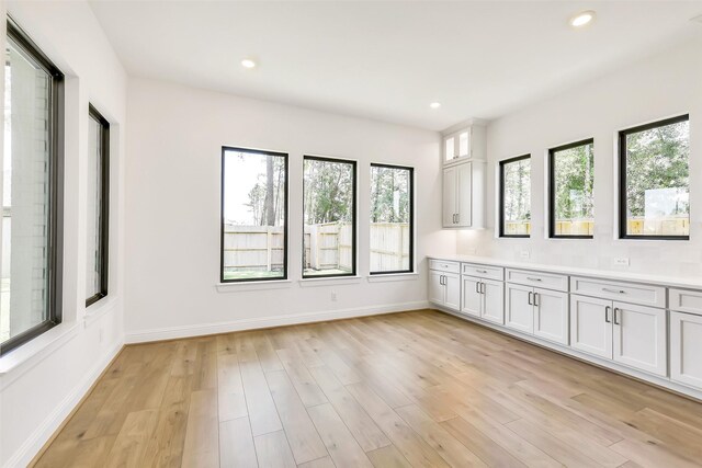 12926 Whitewater Way, Conroe, TX 77302 - spare room featuring healthy amount of natural light, light wood-style floors, and recessed lighting