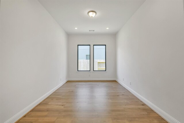 12926 Whitewater Way, Conroe, TX 77302 - unfurnished room featuring light wood-style flooring and recessed lighting