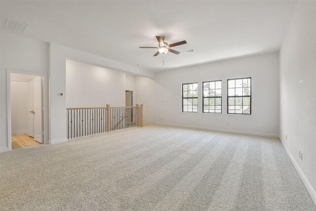 12926 Whitewater Way, Conroe, TX 77302 - empty room featuring a ceiling fan and light carpet