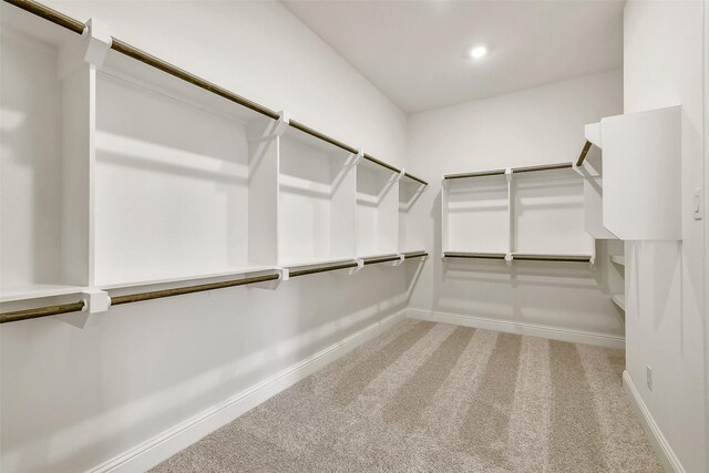 12926 Whitewater Way, Conroe, TX 77302 - walk in closet with carpet floors
