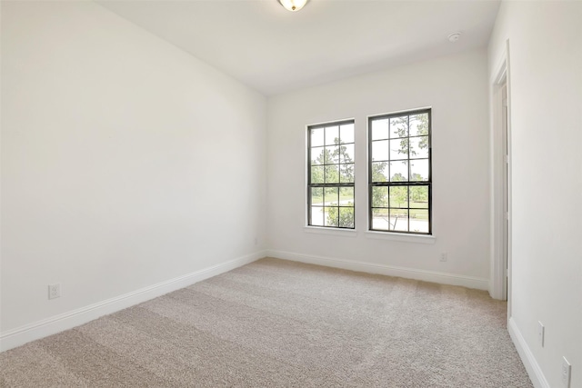 12926 Whitewater Way, Conroe, TX 77302 - unfurnished room featuring light colored carpet and a smoke detector