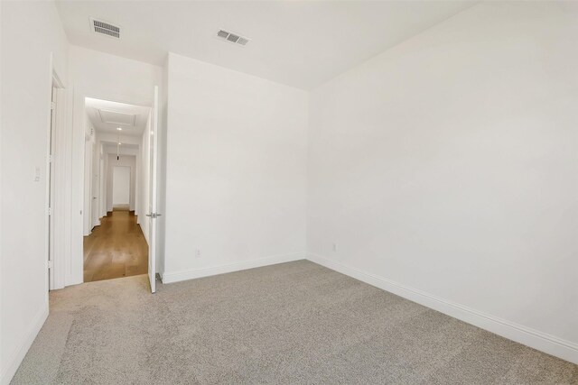 12926 Whitewater Way, Conroe, TX 77302 - carpeted spare room featuring attic access and baseboards