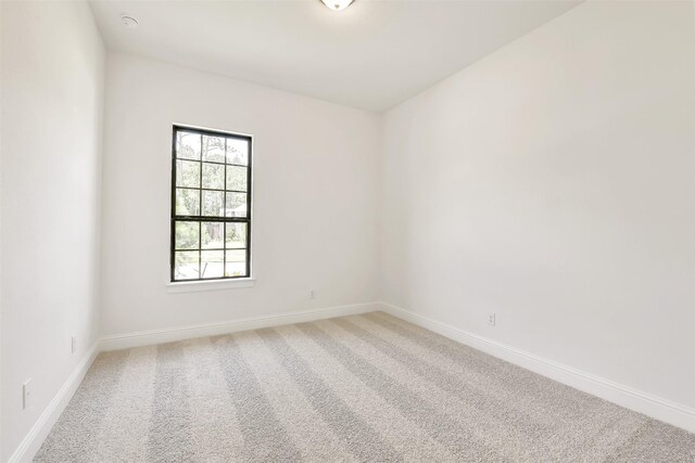 12926 Whitewater Way, Conroe, TX 77302 - empty room featuring light carpet and baseboards