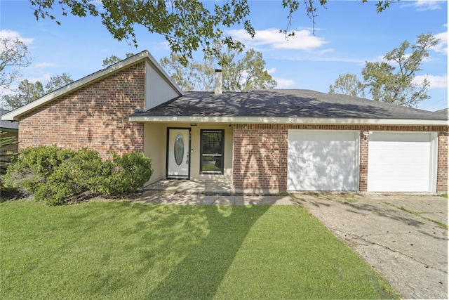 mid-century home featuring driveway, a front lawn, a shingled roof, a garage, and brick siding