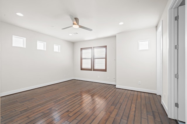 empty room with ceiling fan and dark wood-type flooring