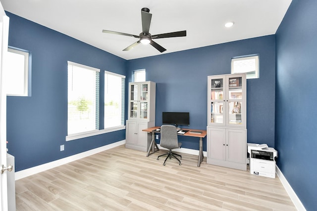 office featuring ceiling fan and light hardwood / wood-style flooring