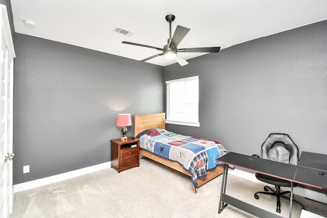 bedroom featuring light carpet and ceiling fan