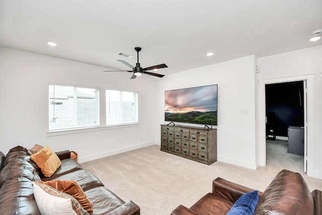 carpeted living room featuring ceiling fan