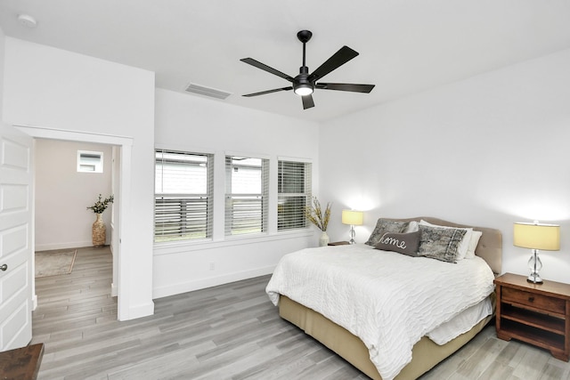 bedroom featuring ceiling fan and hardwood / wood-style flooring