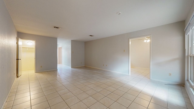 unfurnished room with light tile patterned flooring