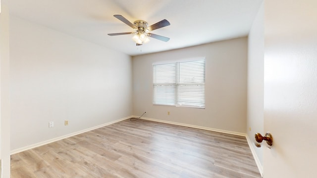 spare room with ceiling fan and light hardwood / wood-style floors