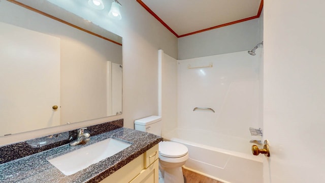 full bathroom with shower / bathing tub combination, crown molding, hardwood / wood-style floors, toilet, and vanity