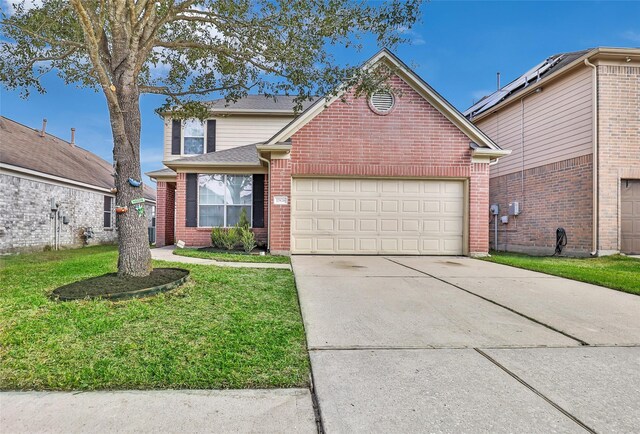 front facade featuring a garage and a front yard