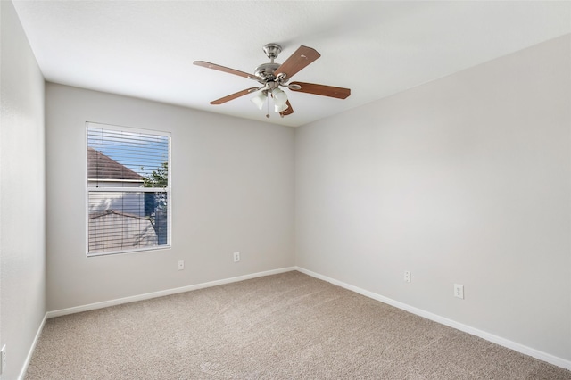 empty room with carpet and ceiling fan