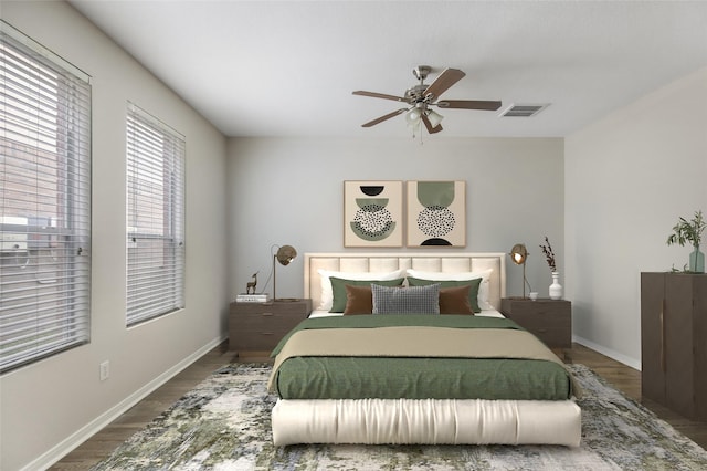 bedroom with ceiling fan and dark hardwood / wood-style flooring