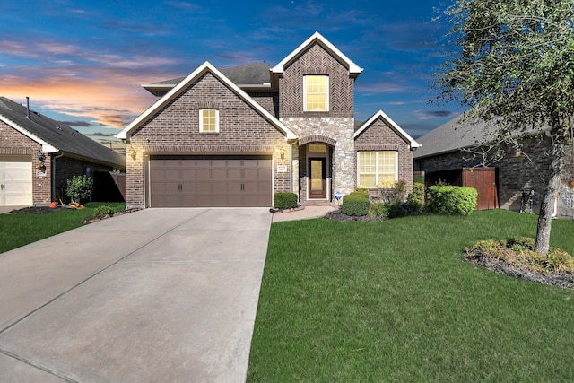 view of front of home featuring a yard and a garage