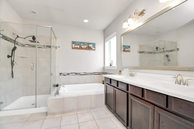 bathroom featuring tile patterned floors, plus walk in shower, and vanity