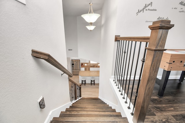 stairway featuring hardwood / wood-style flooring