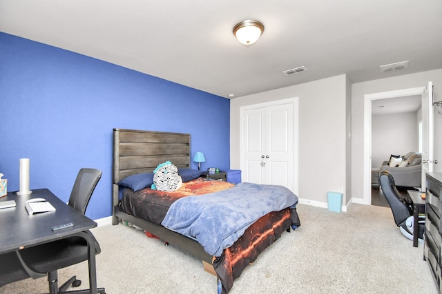 carpeted bedroom featuring a closet